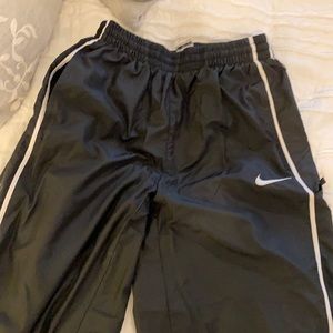 GUC - Nike nylon pants.   Lined.  Youth L.   Black with white stripe